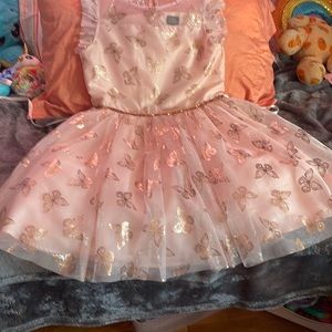 This dress is in good condition there are no tears or rips it is rose gold.